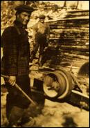 Keith Edgell and unidentified man operating a portable sawmill